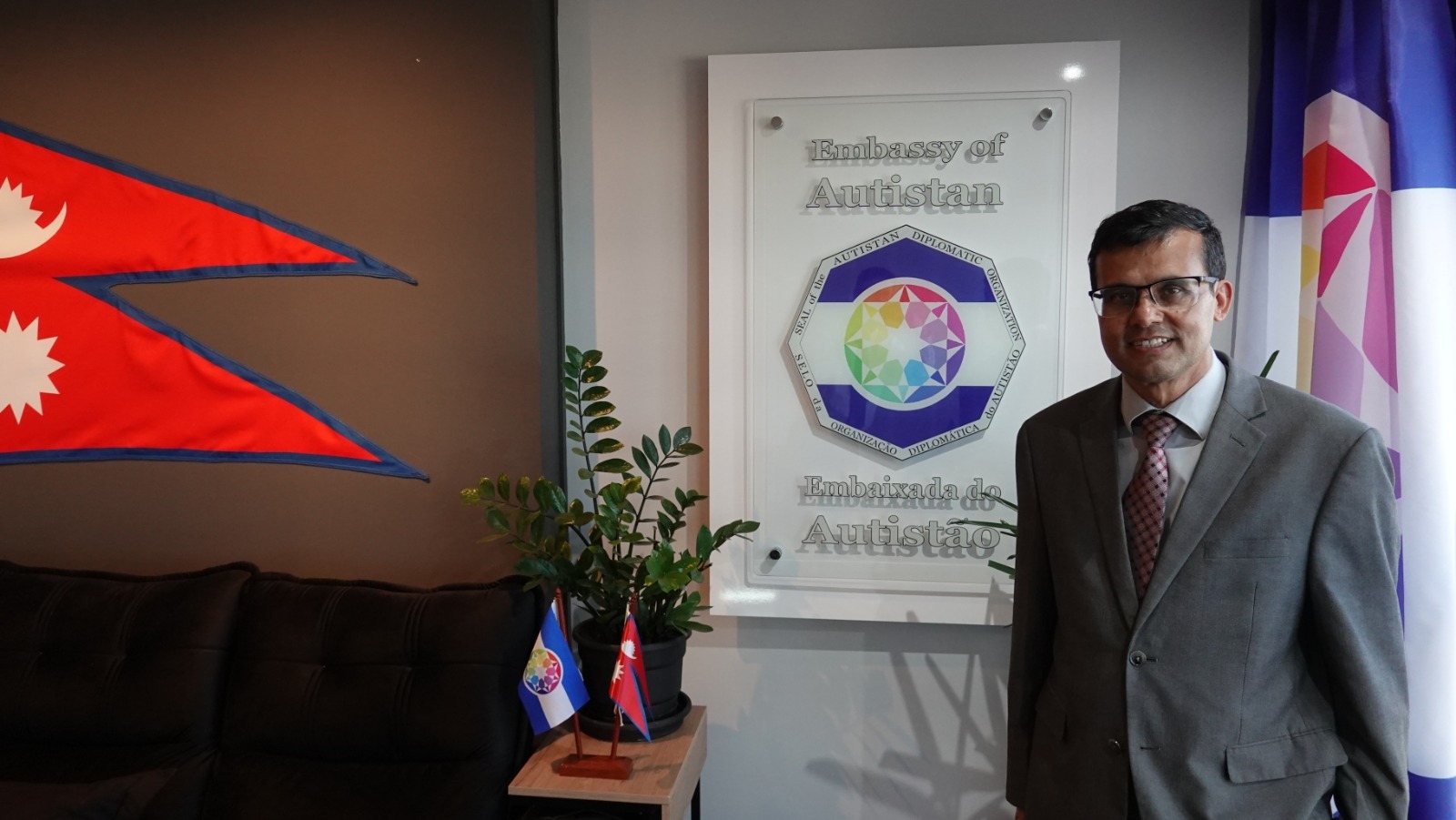 Near the Embassy of Autistan plaque, with the symbols of Nepal and Autistan.