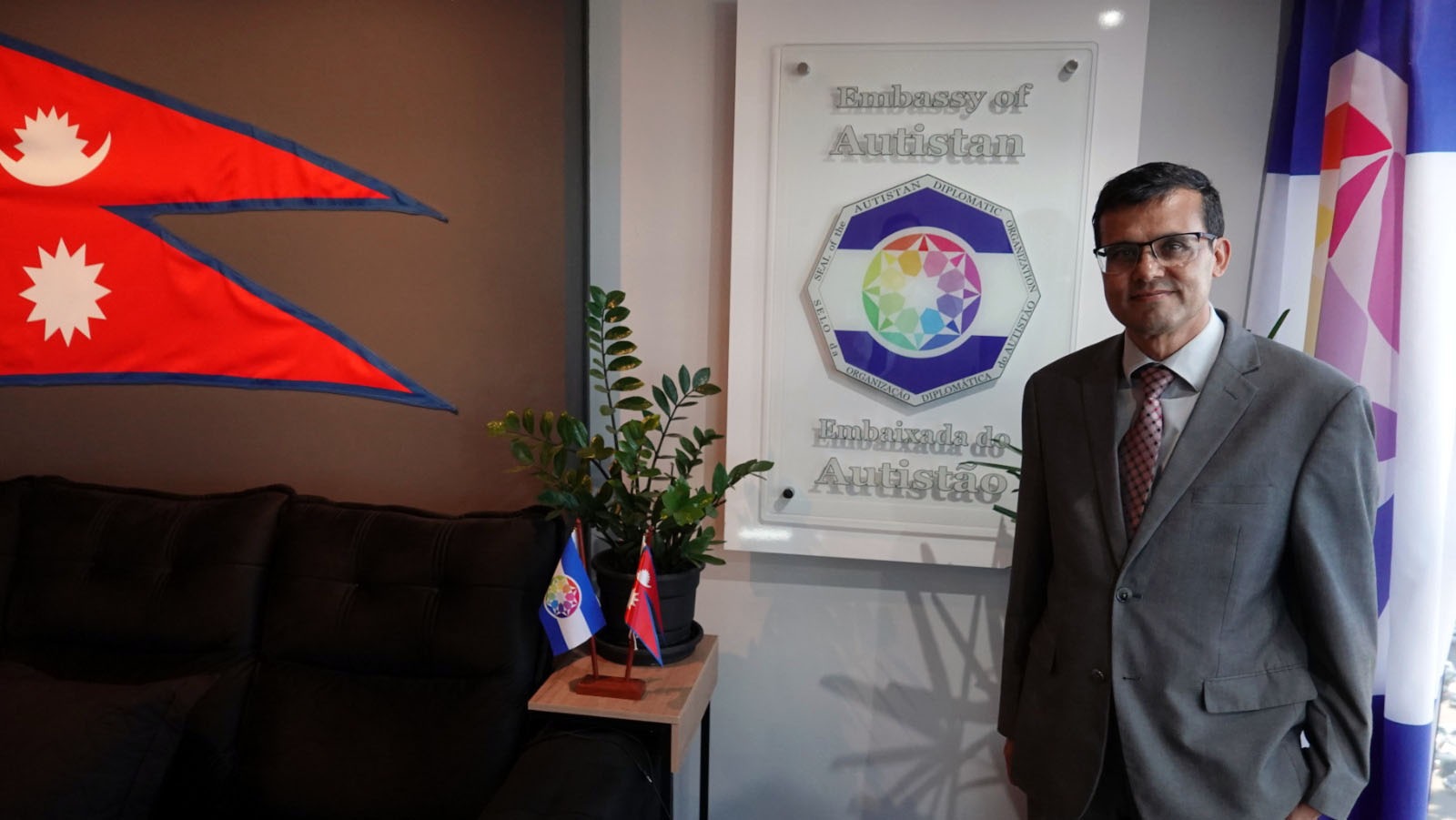 Near the Embassy of Autistan plaque, marking the symbolic character of the visit.